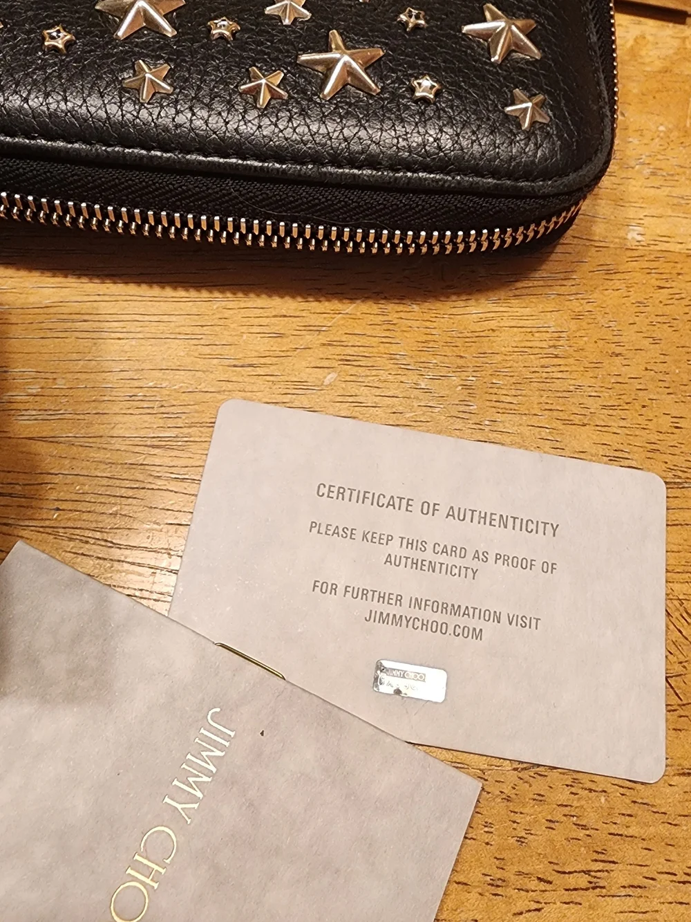 Jimmy Choo Filipa Star Studded Wallet, a black leather zip-around wallet